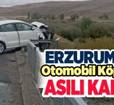 Erzurum’da sürücüsünün direksiyon hakimiyetini kaybettiği otomobil köprüde asılı kaldı!